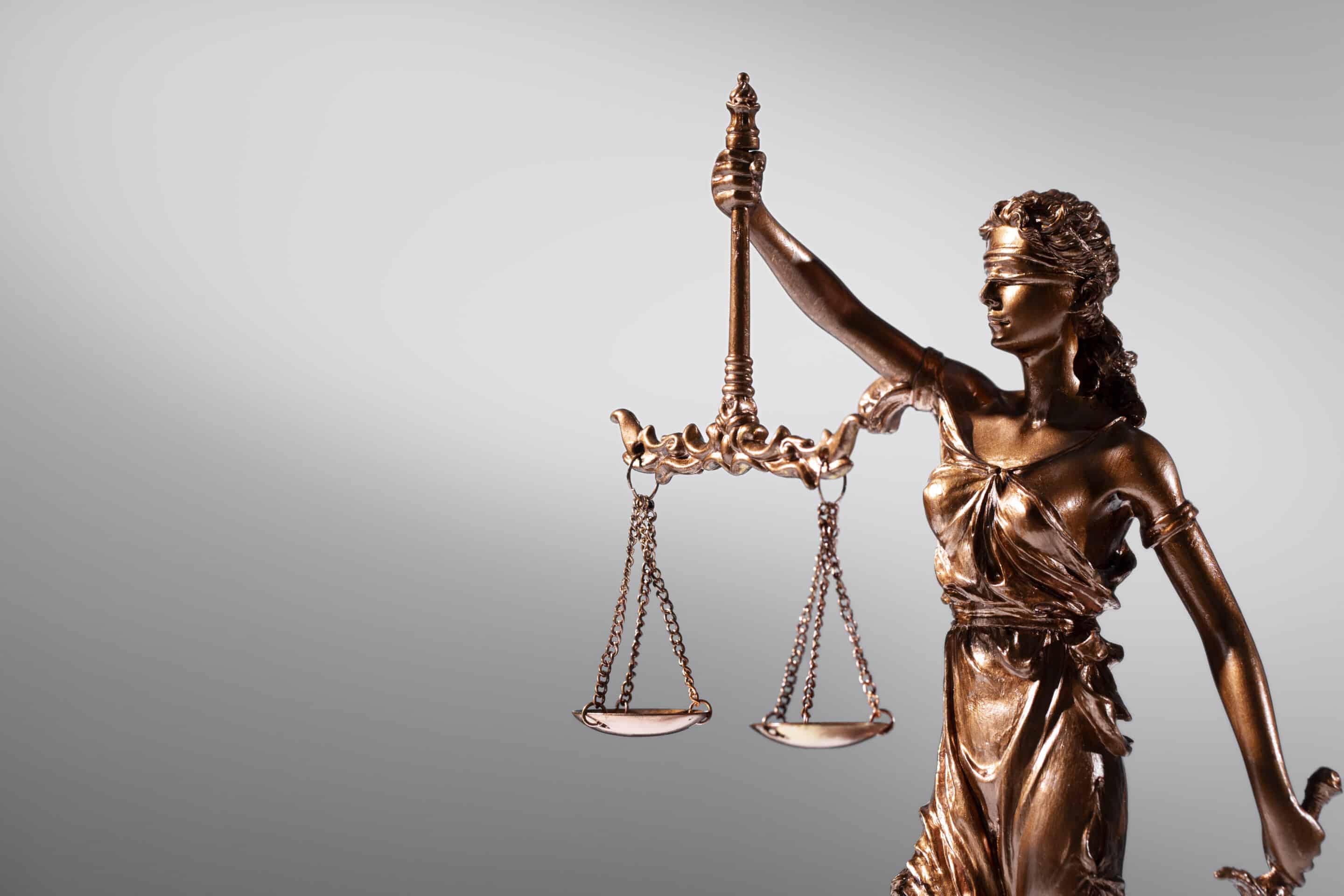 Attorneys Bronze blind Justice carrying scales of justice